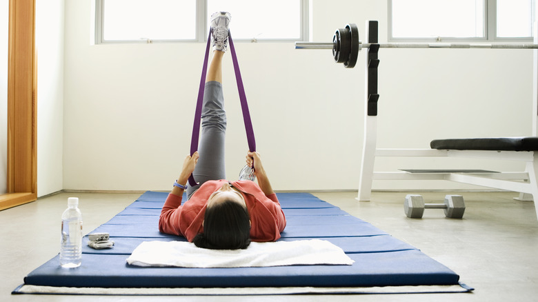 woman stretching after weightlifting