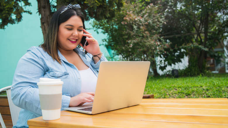Woman on the phone and laptop