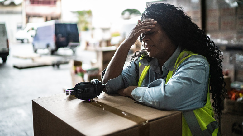 Disheartened warehouse employee