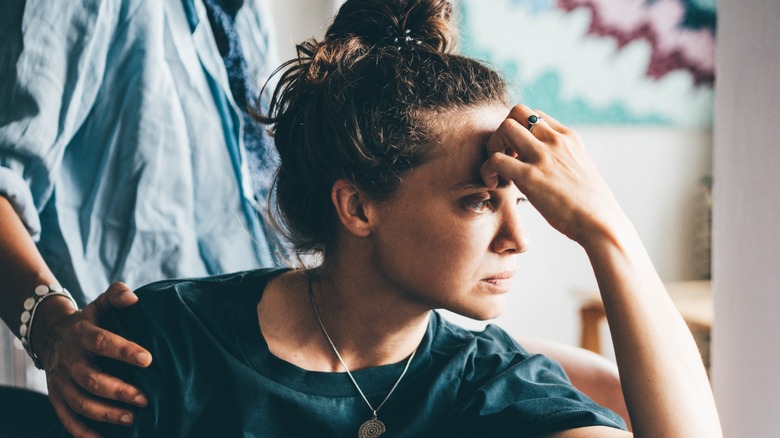 A woman looking unhappy