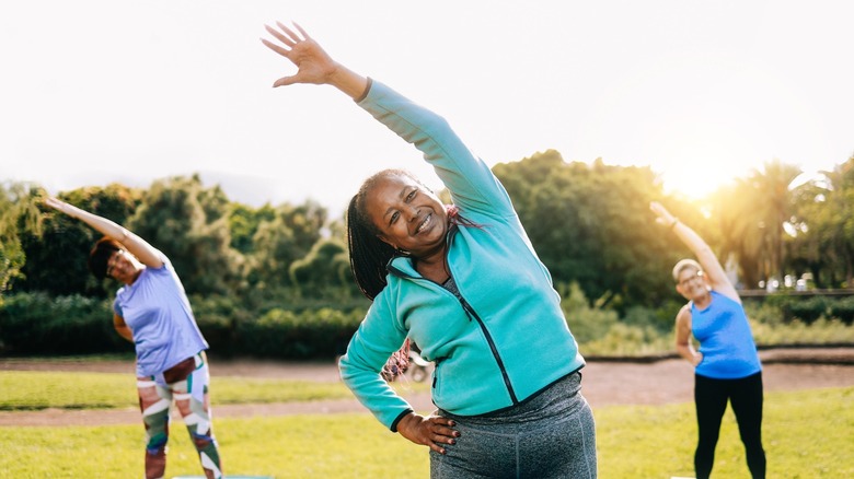 Three women working out outside