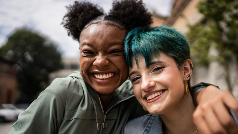Queer people smiling for picture