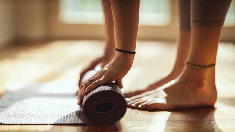 Unrolling yoga mat
