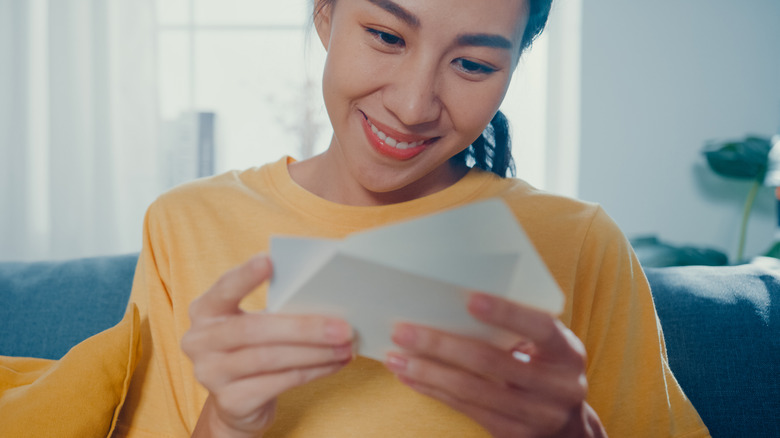 Woman reading card