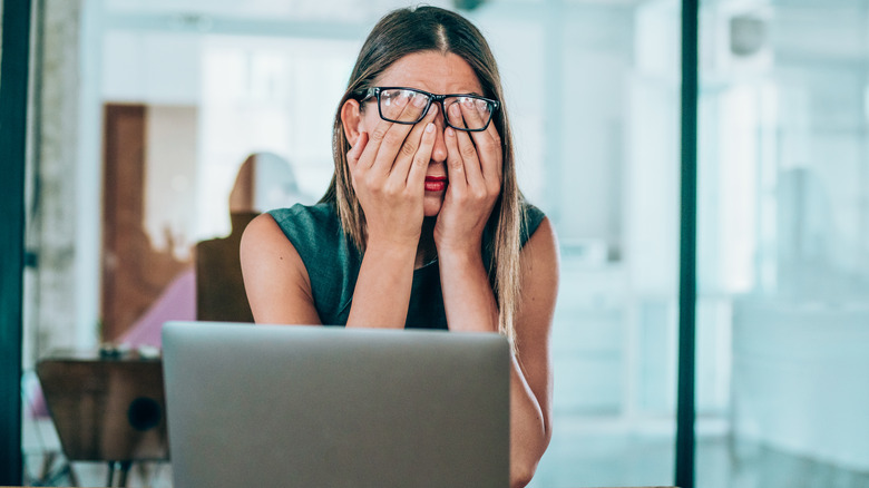 Woman covering face